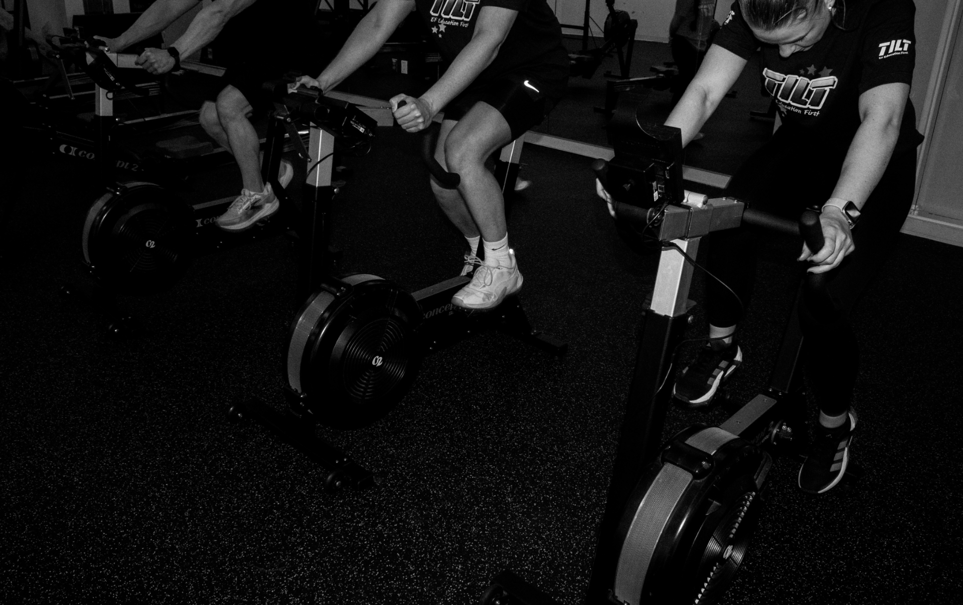 Members riding Concept 2 bikes during class